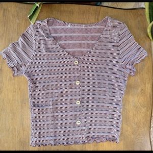 Pink and white patterned shirt with sleeve ruffles and buttons. Size: Small